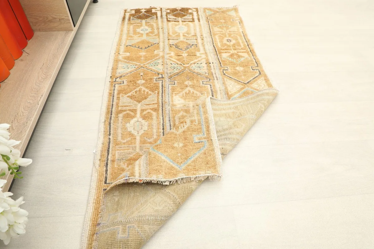 Rug partially folded, displaying the reverse side and overall design