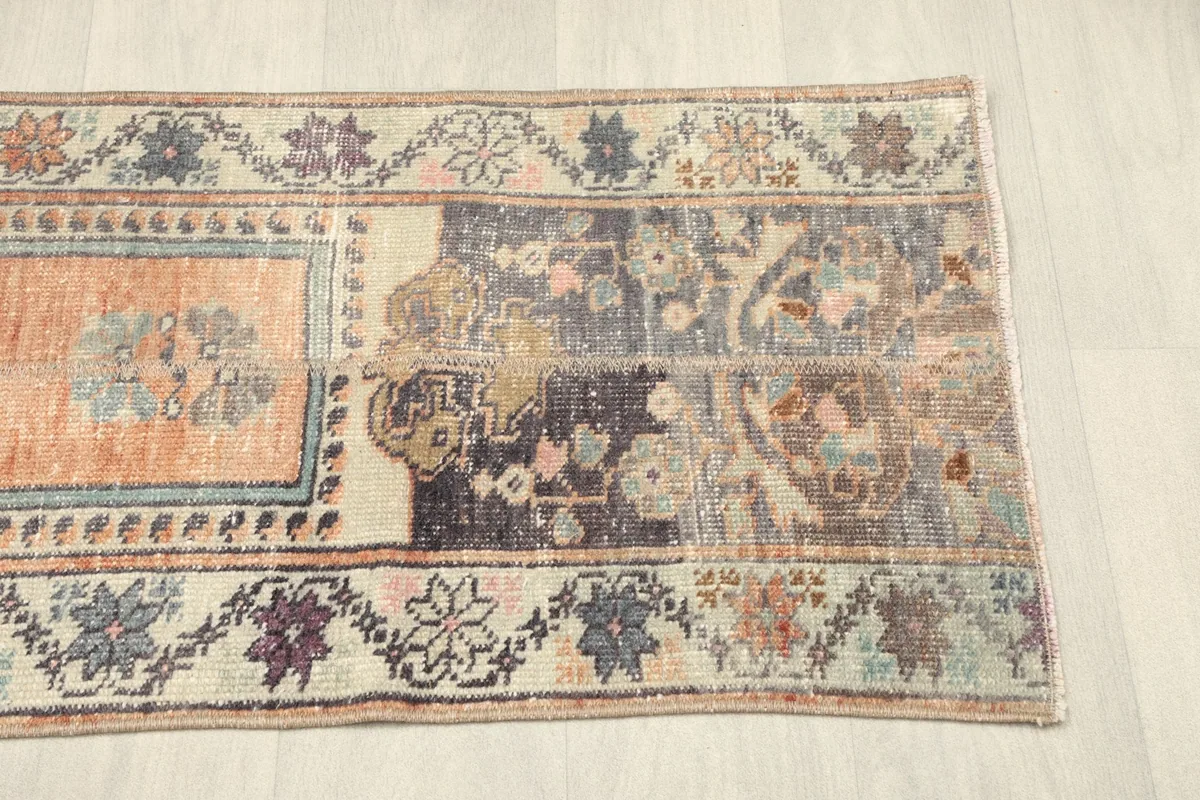 Detail of the opposite end of the rug, showcasing the intricate border designs.
