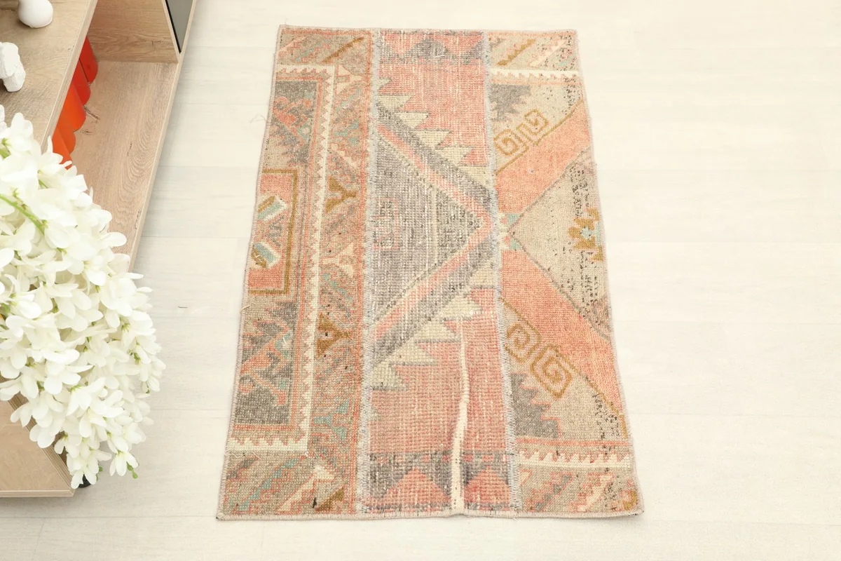 Overhead view of the vintage Anatolian runner rug, showcasing its patchwork design and colors.