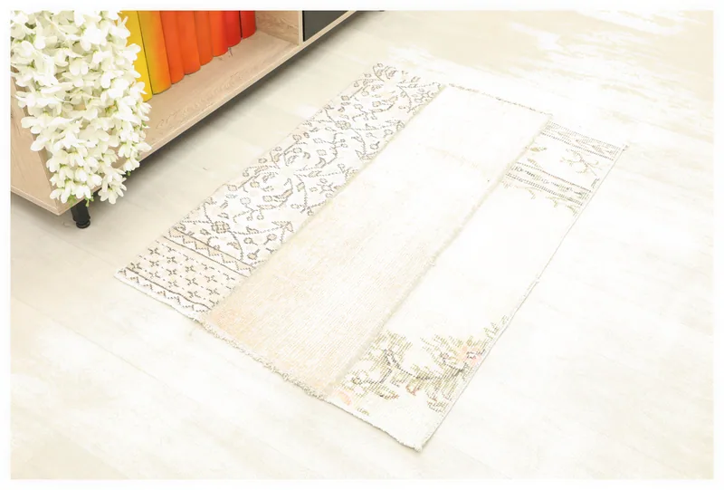 Full top view of the 2x3 beige patchwork vintage Anatolian rug on a white background.