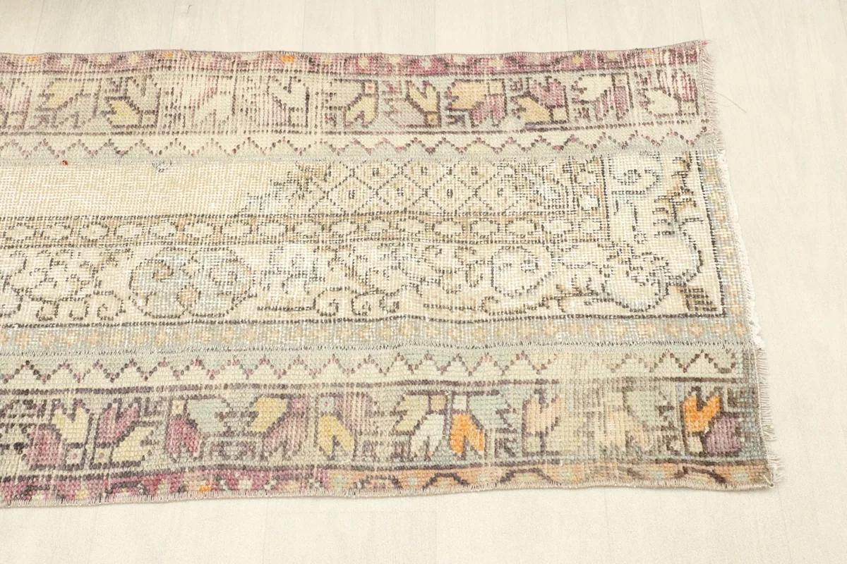 Overhead view of the other side of the rug, showing the continuation of the variegated patterns