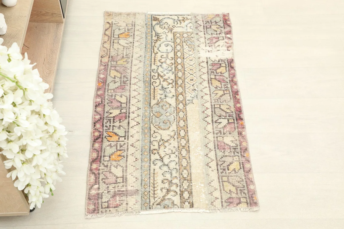 Overhead view of the hand-knotted rug, showcasing its tribal geometric design and colors.