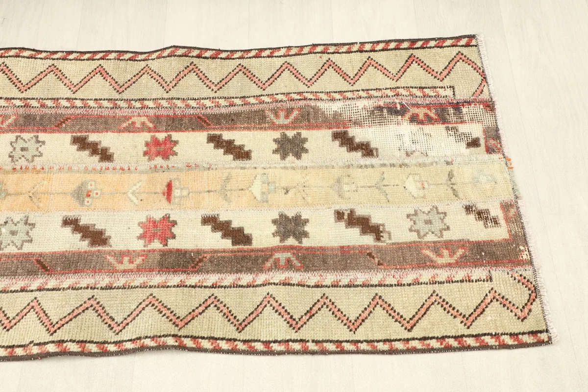 Close-up showing areas of natural patina and wear on the vintage wool pile