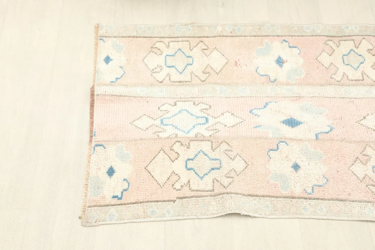 The rug folded to show its flexibility and the texture of the hand-knotted wool pile.