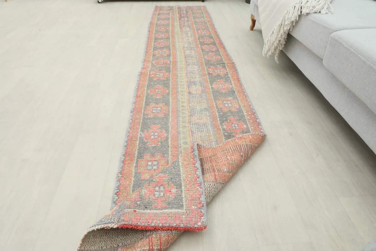 Runner rug partially folded, showing its flexibility and the full pattern length