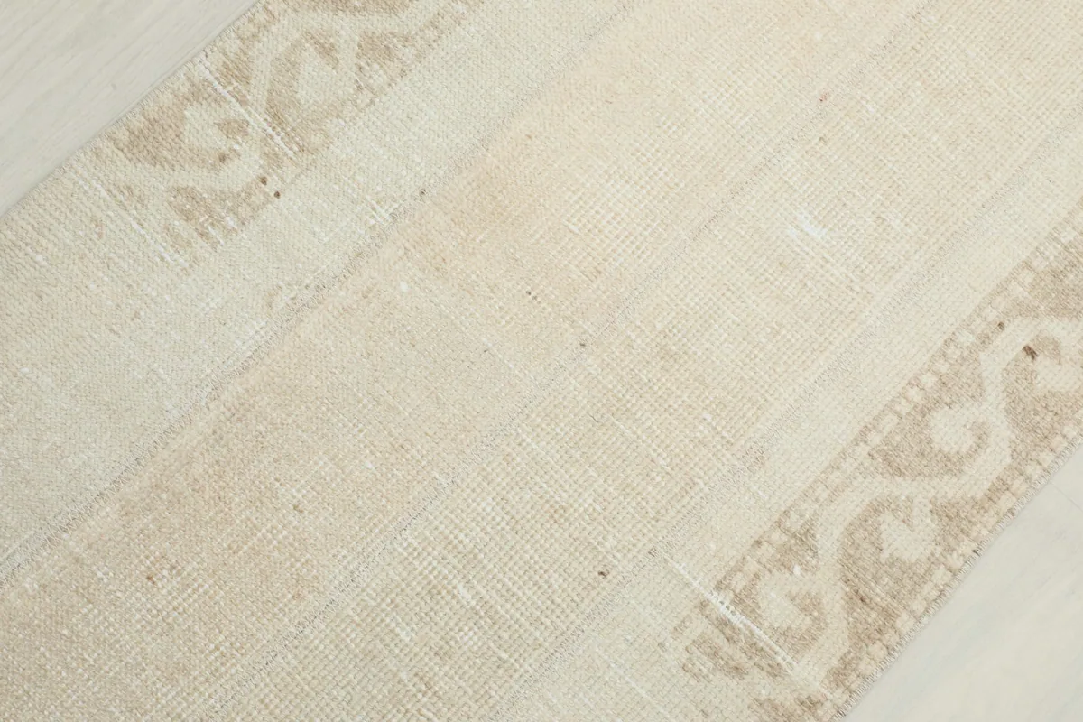 Overhead close-up showing the blend of cream tones and the tan geometric patterns