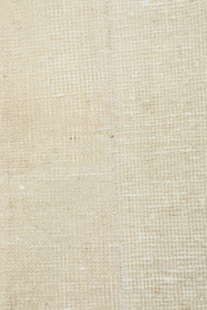 Close-up of the cotton foundation on the back of the hand-knotted wool rug