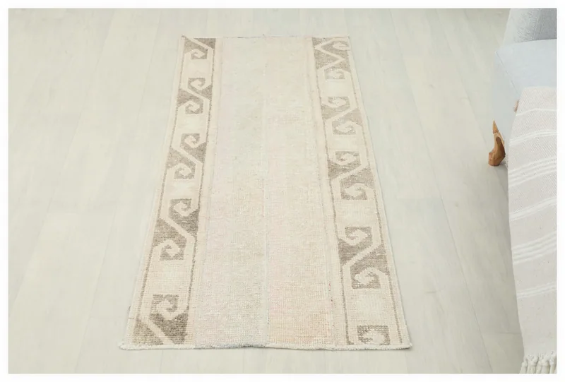 Full top view of the 2x4 beige vintage Anatolian rug on a white background