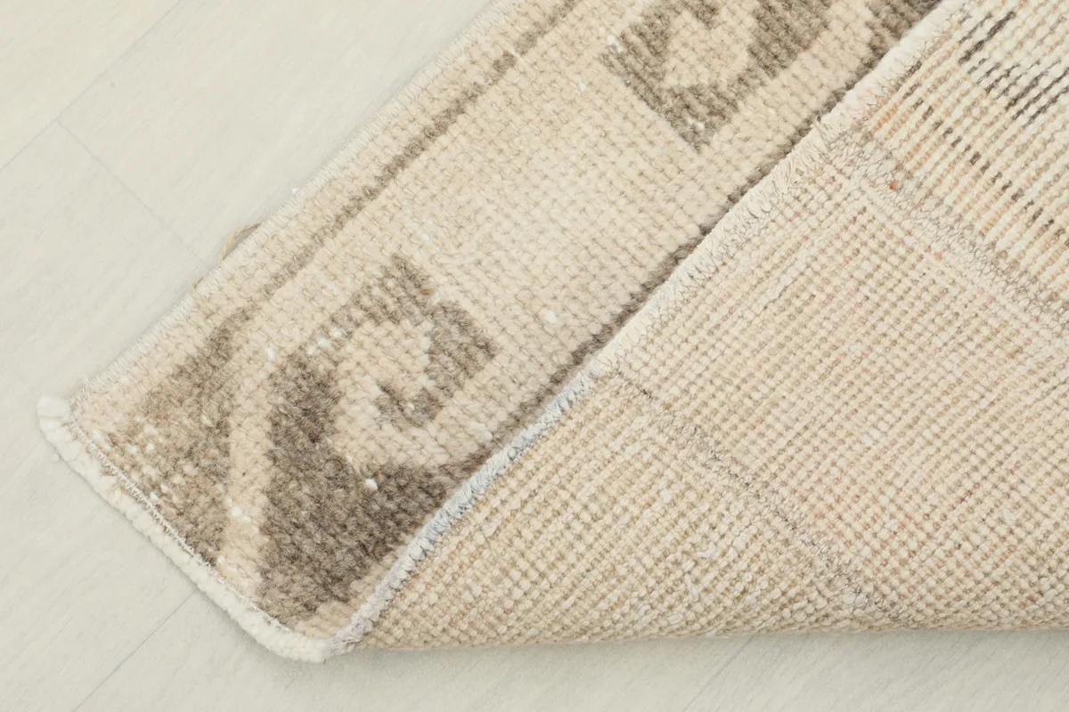 Underside of the hand-knotted rug revealing the cotton foundation