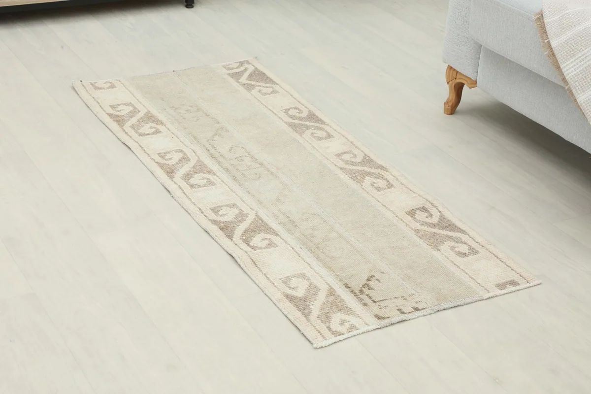 Angled view of the beige and brown Anatolian runner showcasing its full length and patterns.