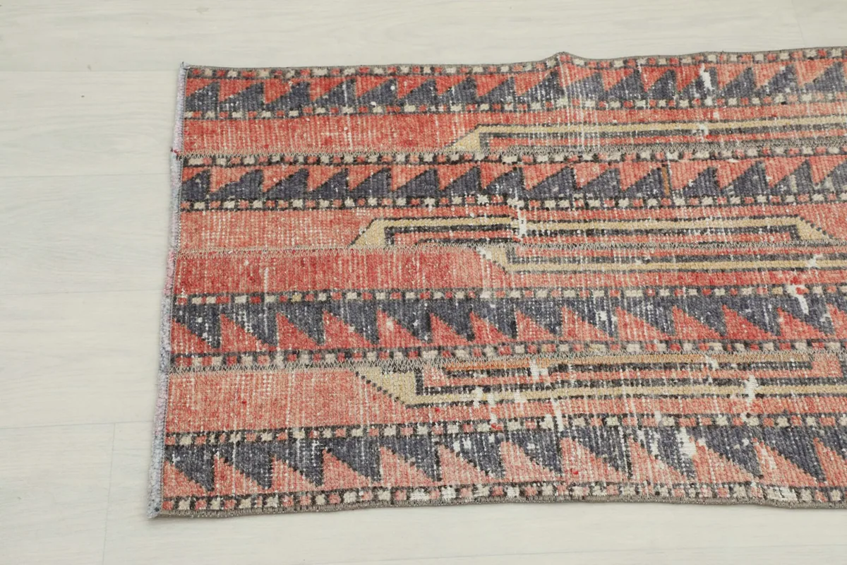 Detailed view of the rug's opposite end, emphasizing the distinct tribal-inspired patterns.