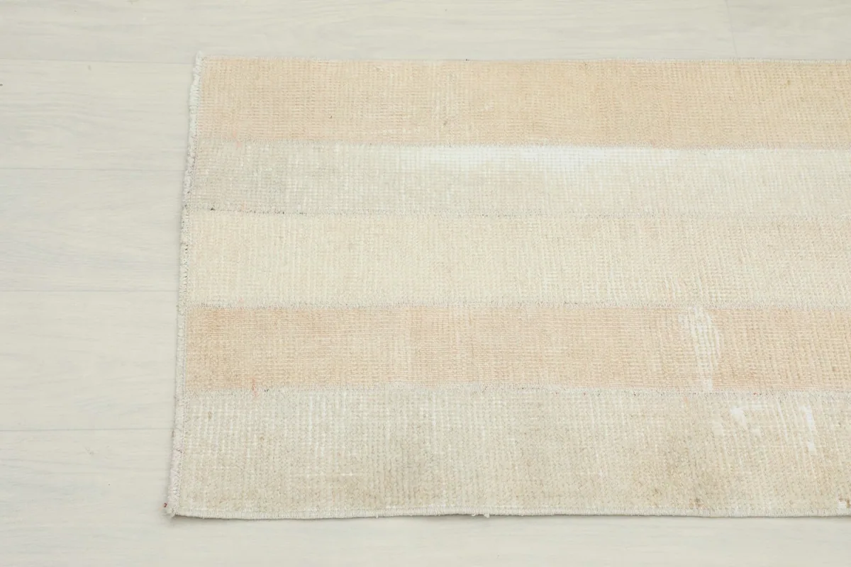 Another close-up showing the subtle color variations and weave of the vintage wool rug