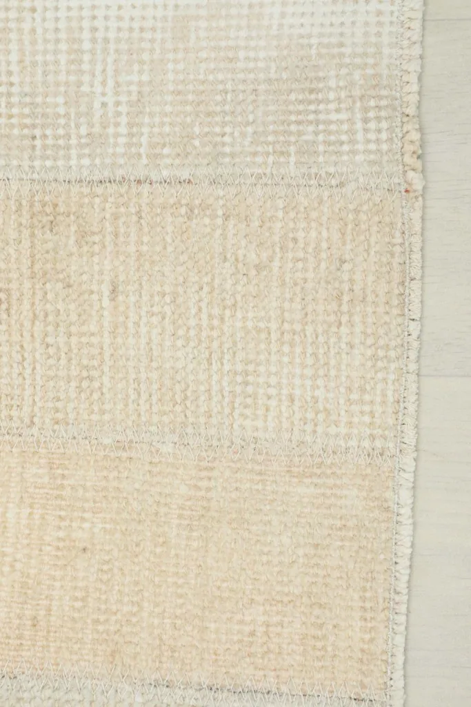Edge detail of the rug, showing the consistent weave and subtle color shifts