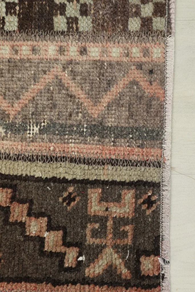 Extreme close-up showing the hand-knotted wool pile and the intricate pattern details