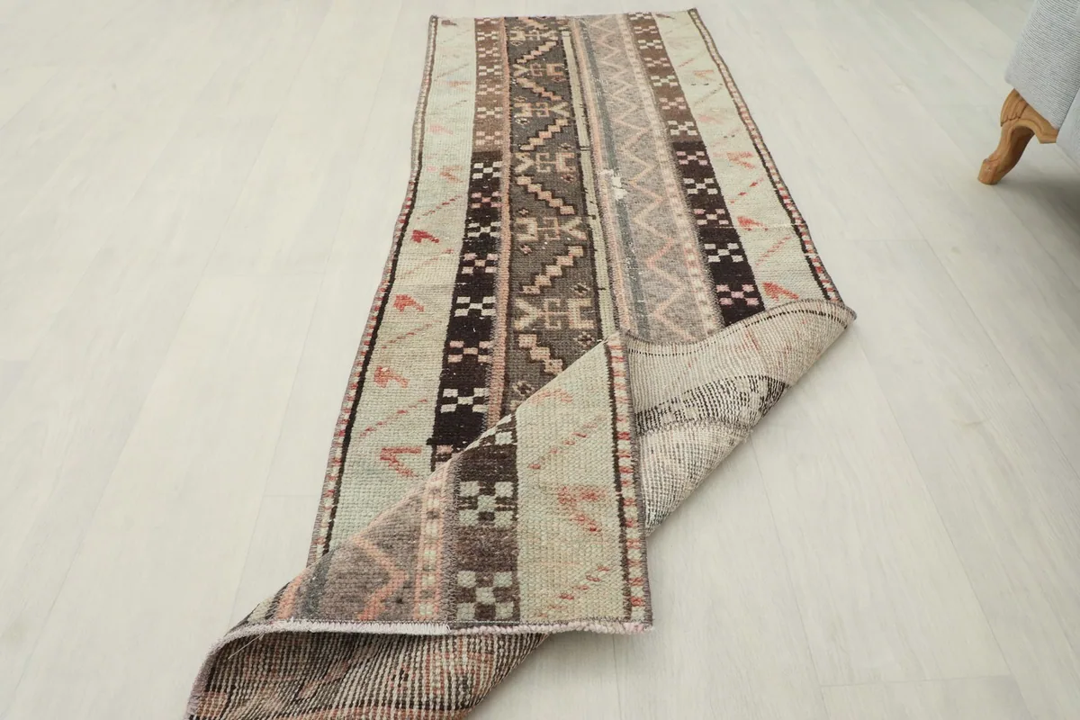 The runner rug folded to show its flexibility and thickness