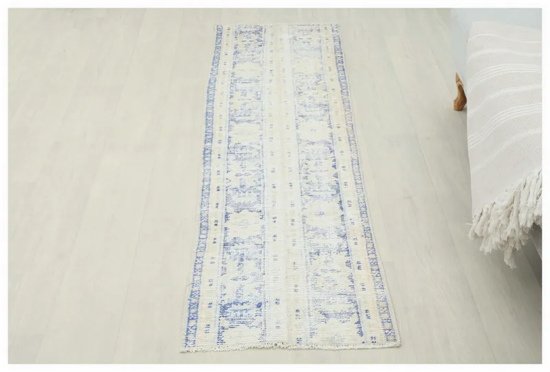 Full overhead view of the 1'7" x 5'9" blue and ivory geometric runner rug