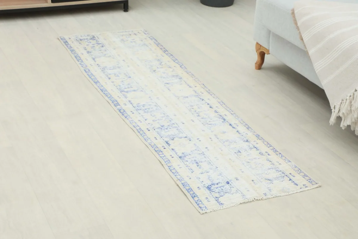 Overhead view of the vintage runner rug showing its full length and pattern
