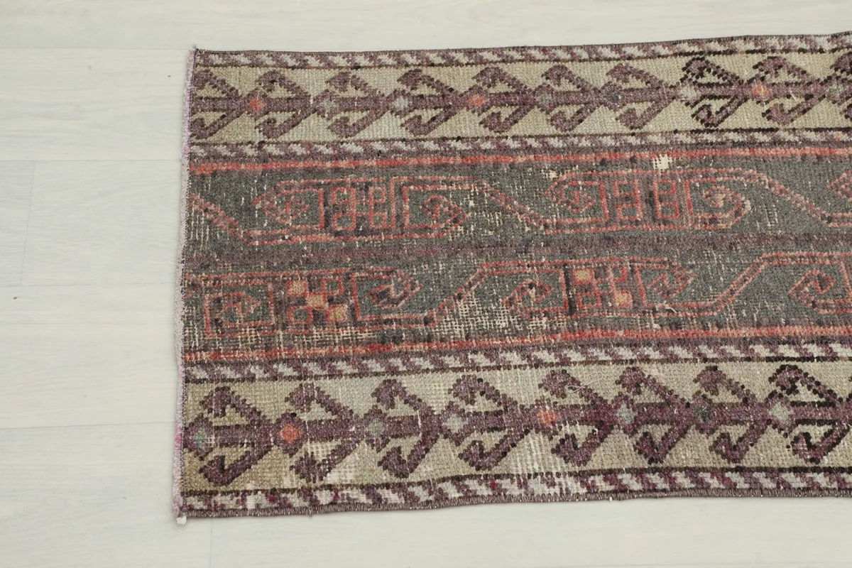 Close-up of the other end of the rug, detailing the tribal patterns and color variations.