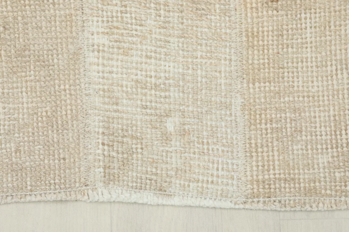 Close-up of the end of the runner, showing the short, natural fringe and the rug's edge.