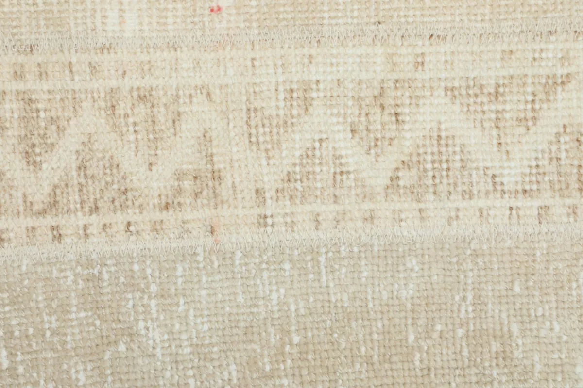 Extreme close-up of the rug's low pile and intricate geometric weaving