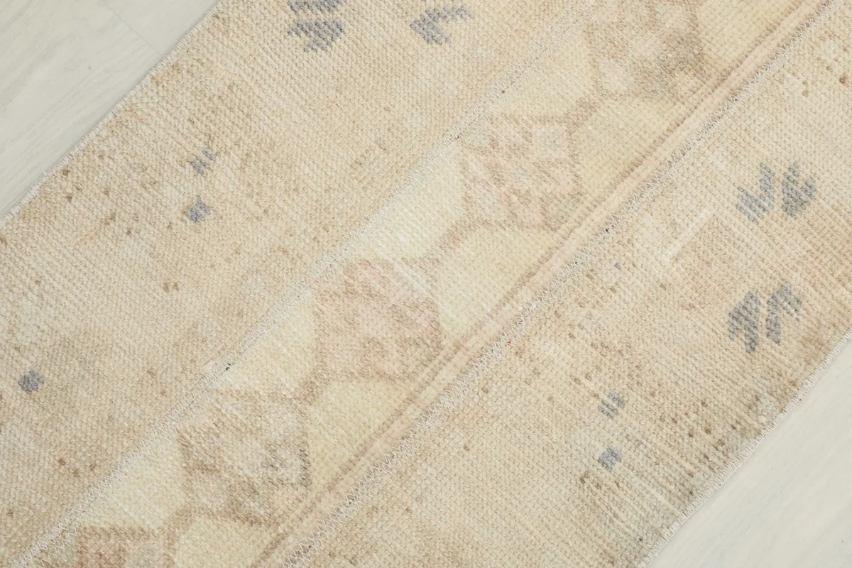 Diagonal close-up showing the subtle variations in color and texture of the wool pile.