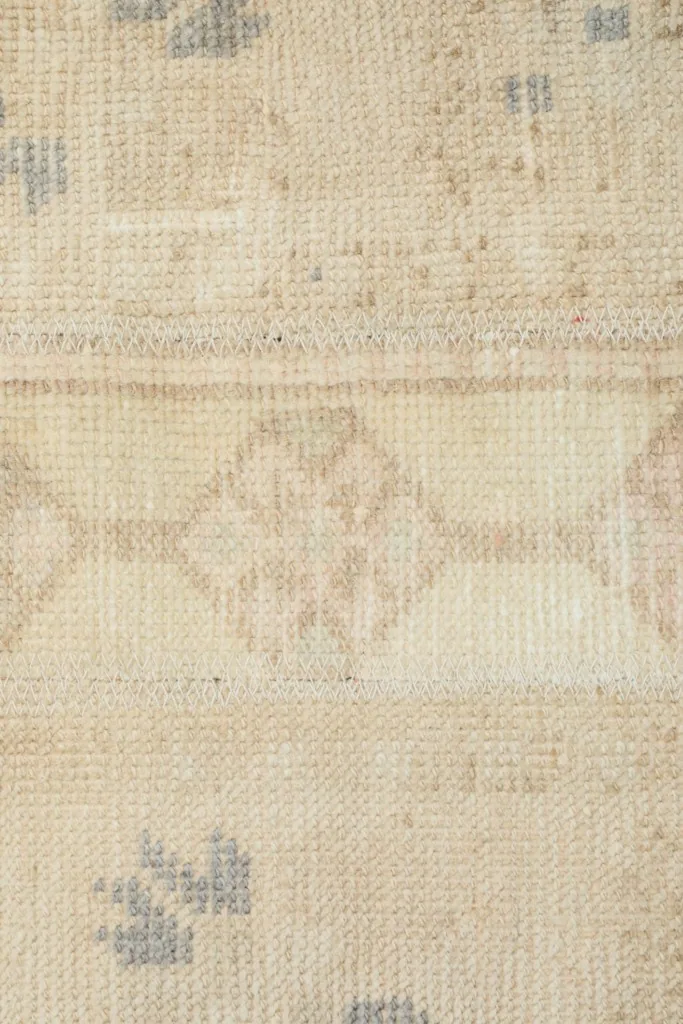 Detailed view of the central geometric design and surrounding field, revealing minor wear.