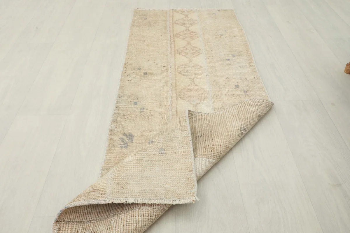 Runner partially folded, displaying both the pile side and the woven cotton foundation.