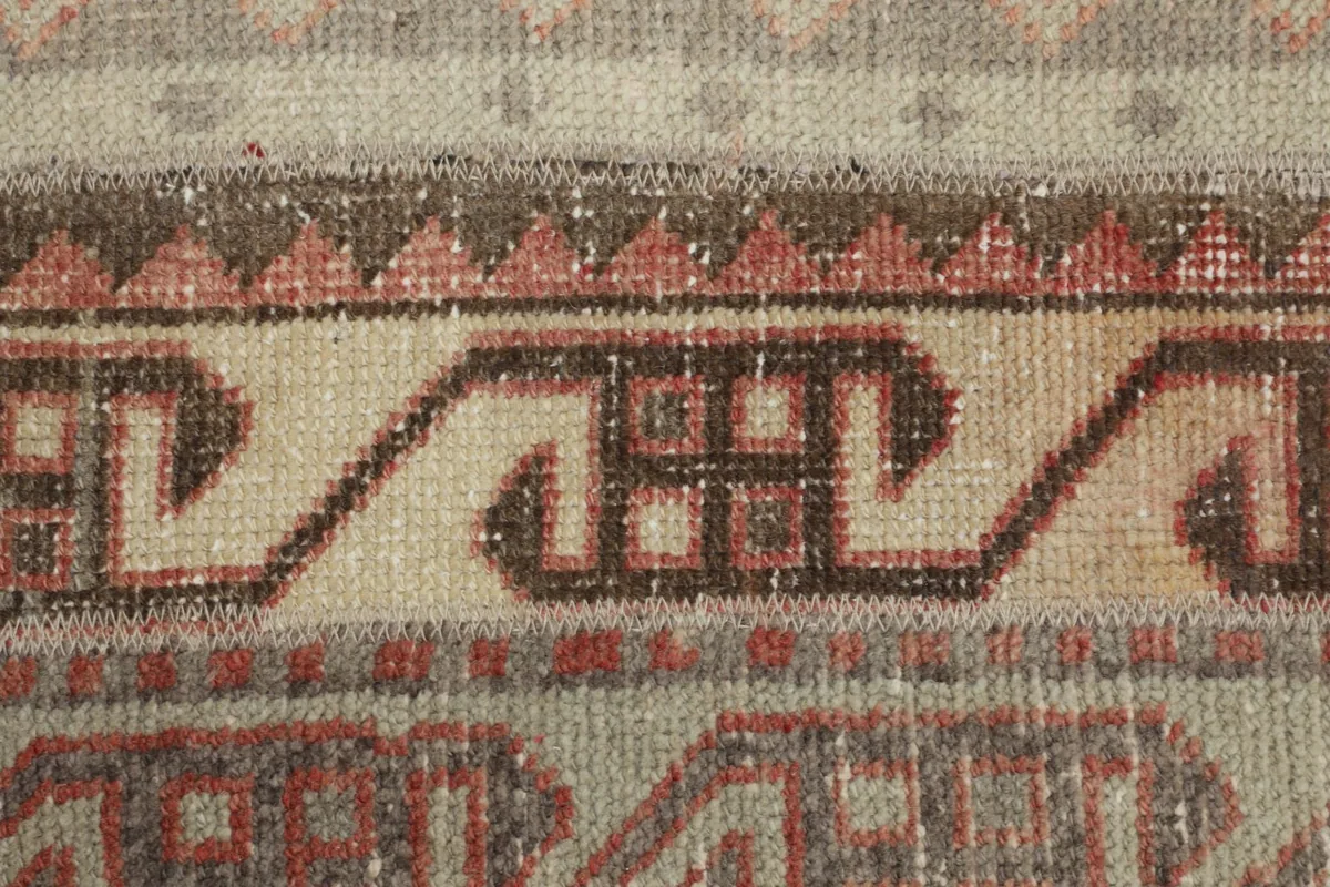 Extreme close-up of the central tribal designs and the surrounding geometric patterns