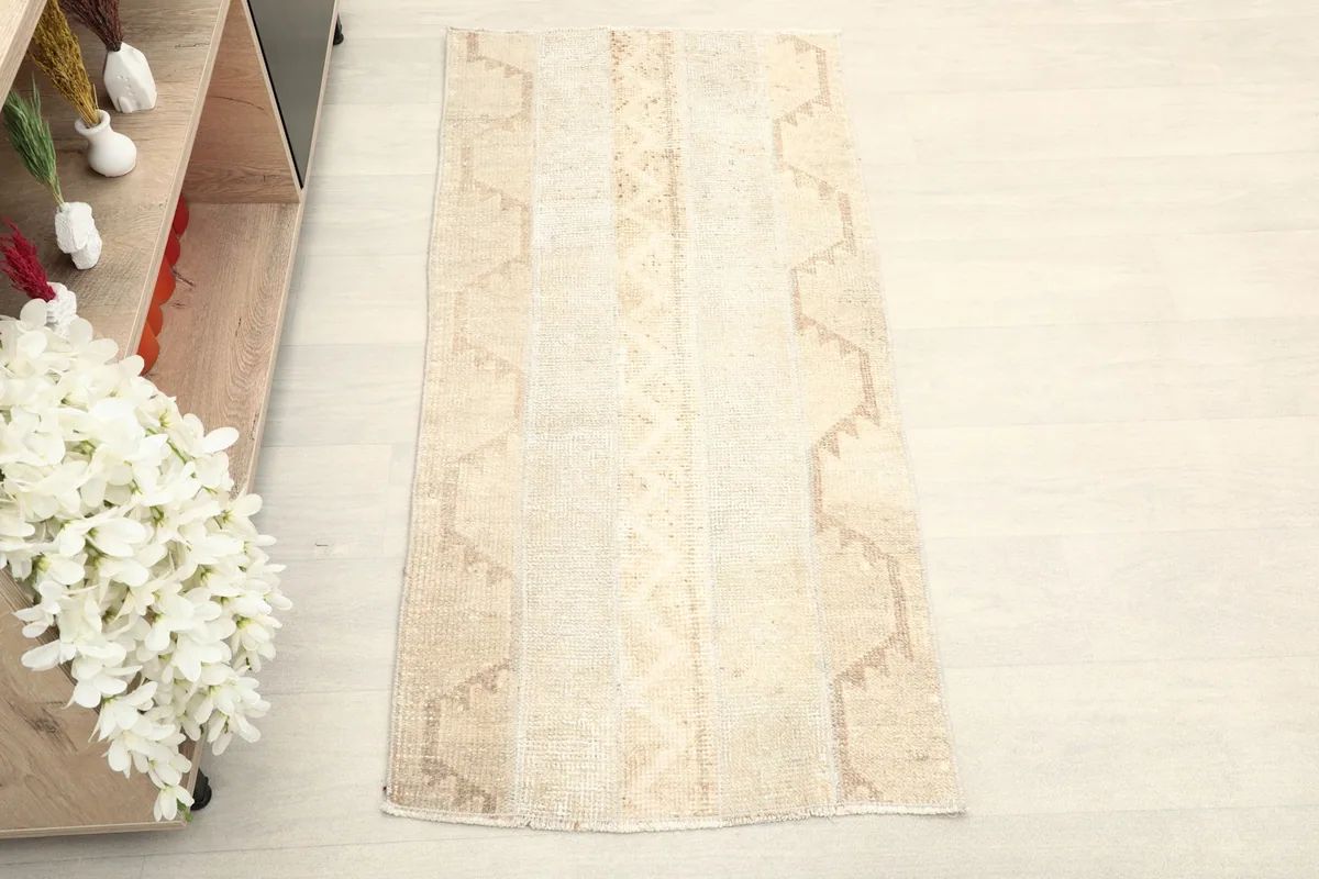 Overhead view showcasing the full length and subtle geometric patterns of the rug.