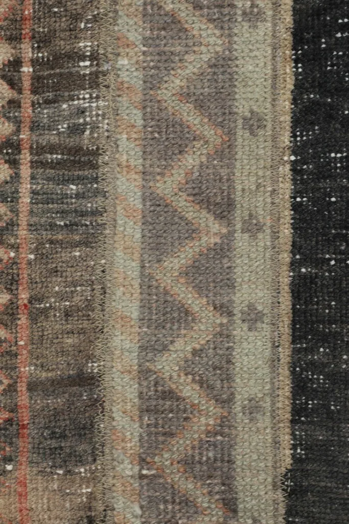 Macro view of the low wool pile, revealing the texture and subtle color variations.