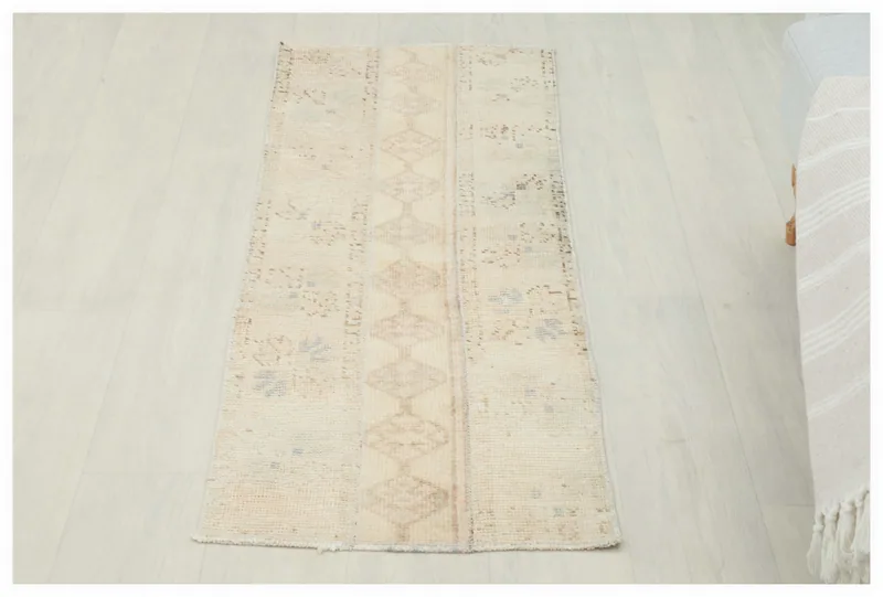 Full overhead view of the 1'8" x 4'6" cream geometric Anatolian runner on a white background.