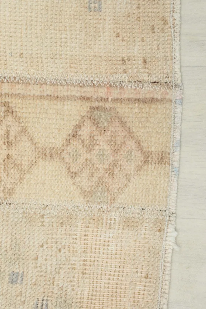 Close-up of the edge of the runner, showing the subtle border and knotting.