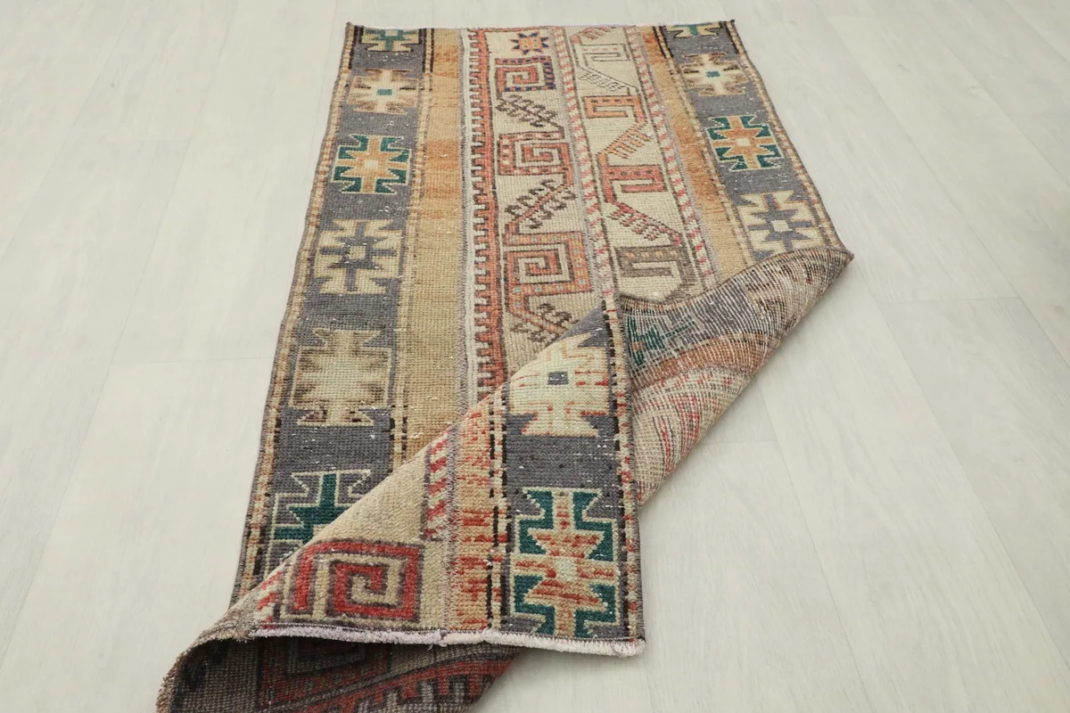 Rug partially folded, displaying the overall pattern and flexibility