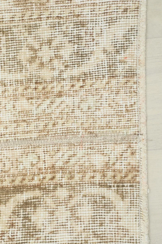 Edge of the runner rug, showing the border design and side finishing