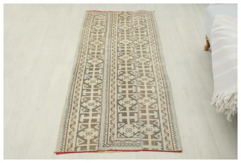 Full top view of the 2x6 vintage Anatolian runner rug with beige and brown geometric patterns