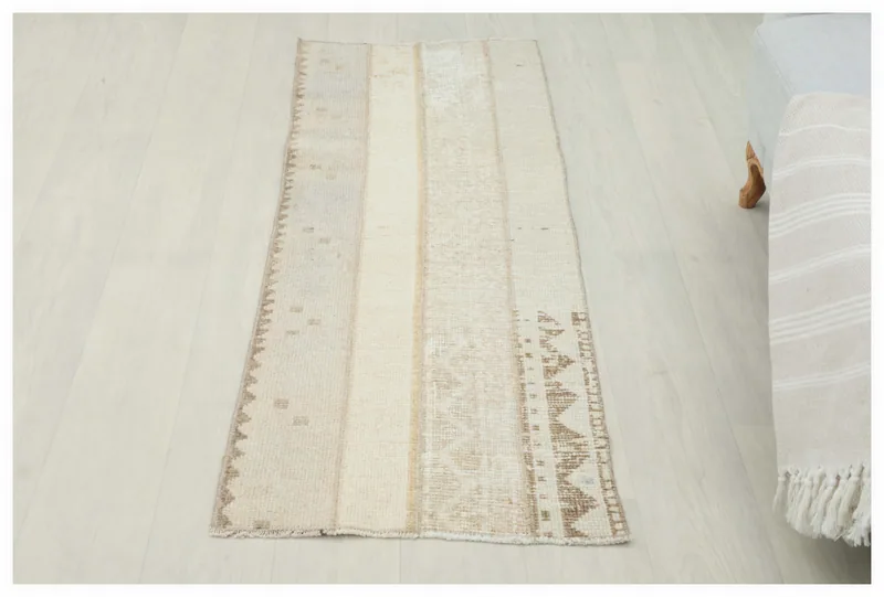 Full top view of the 1'10" x 4'11" vintage Anatolian runner rug on a white background.