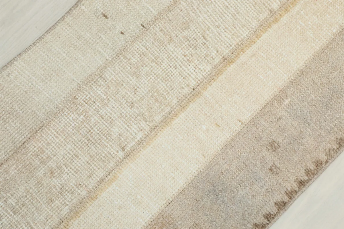 Overhead view showing the low wool pile and the texture of the hand-knotted vintage runner.