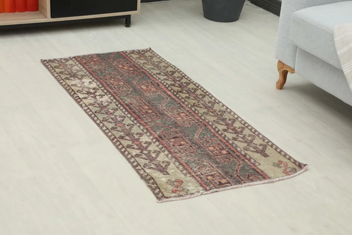 Angled view of the hand-knotted Anatolian rug, highlighting its tribal patterns