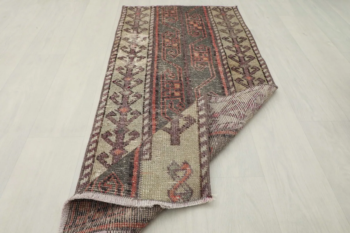 The rug folded to show its flexibility and the reverse side with its natural colors