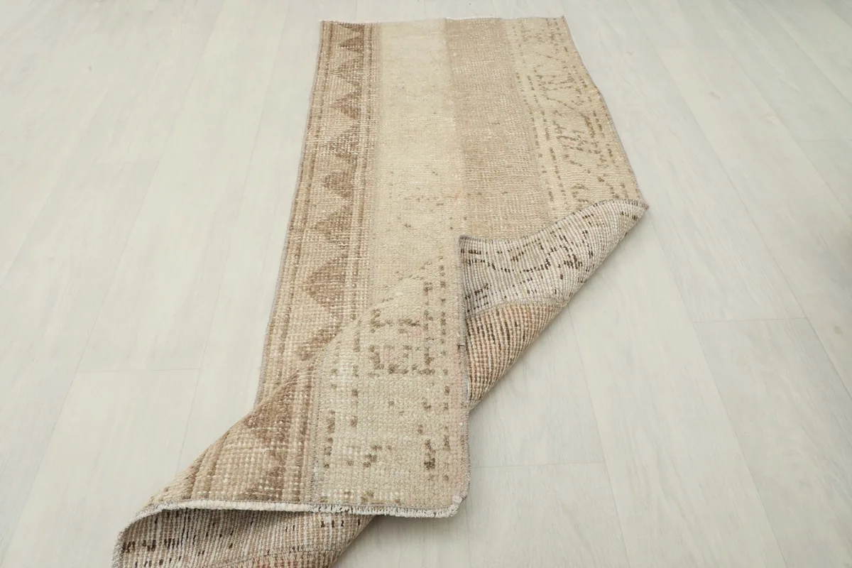 Runner partially folded, demonstrating its flexibility and construction