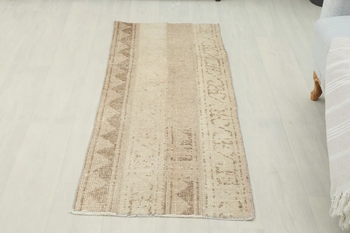 Overhead view of the beige runner, highlighting its subtle color variations and patterns