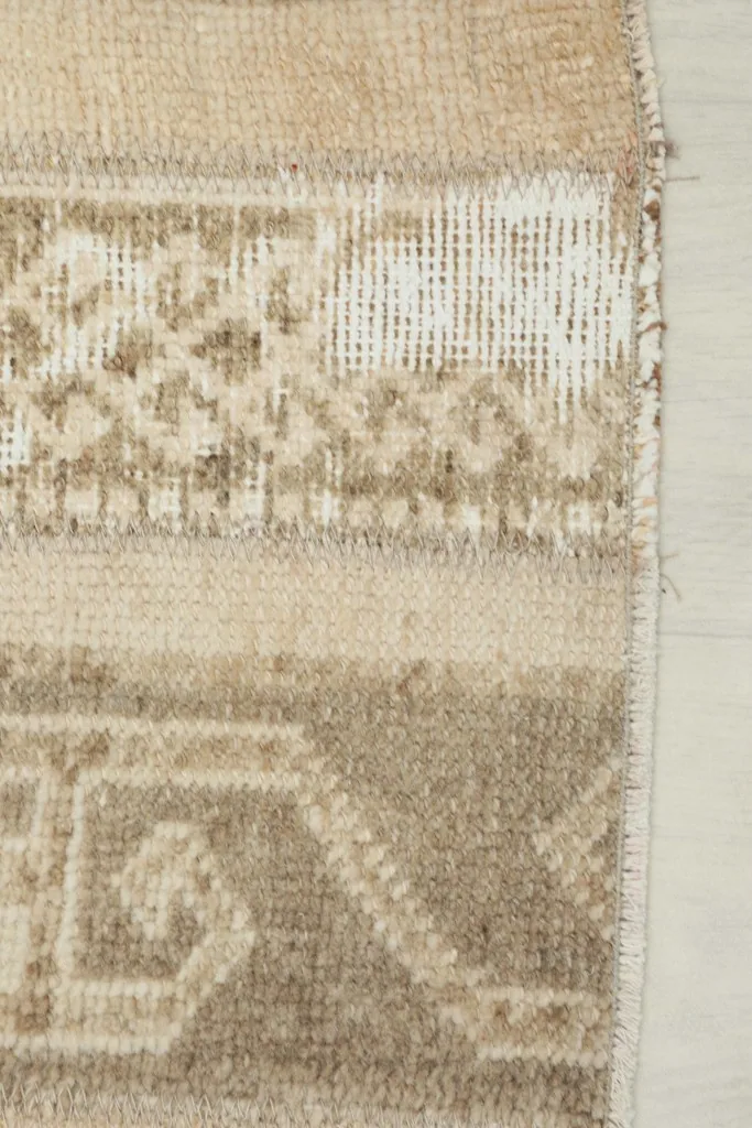 Close-up of the low wool pile and the hand-knotted texture of the rug