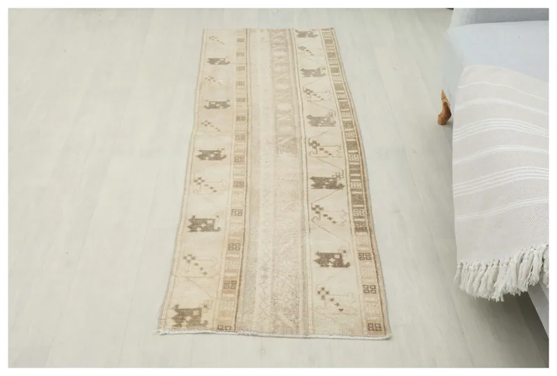 Full top view of the 1'11" x 5'7" beige and brown vintage Anatolian runner rug on a white background.