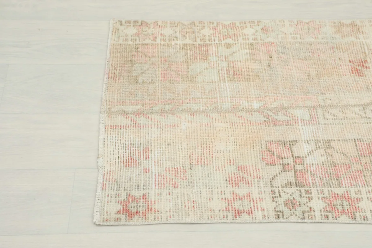 Close-up of the other end of the rug, detailing the subtle variations in color and pattern.
