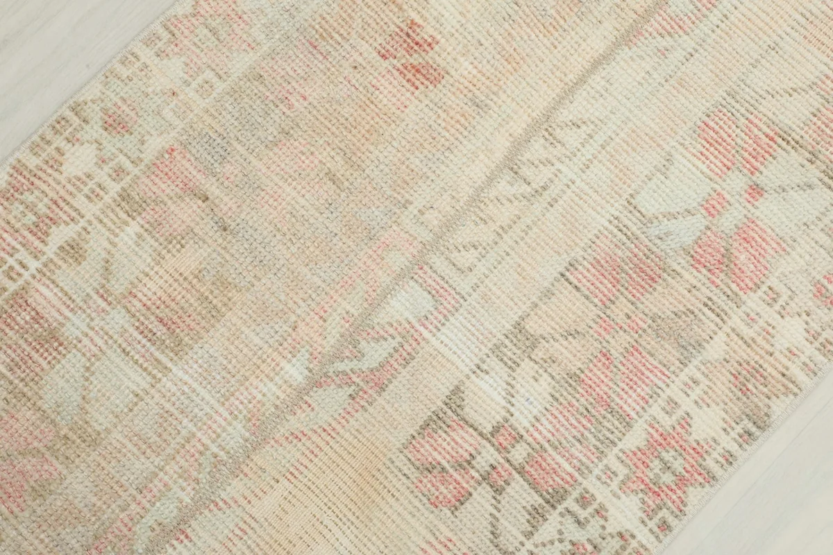 Detailed view of the low pile and weave of the hand-knotted wool rug.