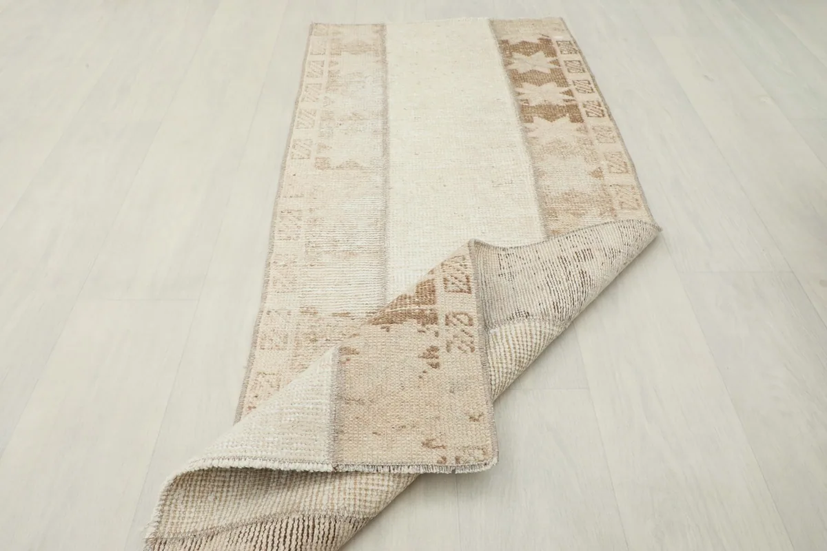 The runner rug partially folded, showing the flexibility and construction from an elevated angle.