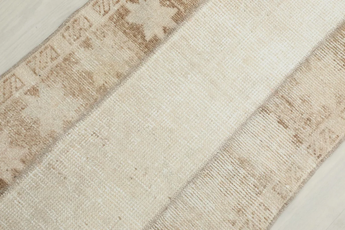 Overhead diagonal view showcasing the texture and distinct color blocks of the hand-knotted runner.