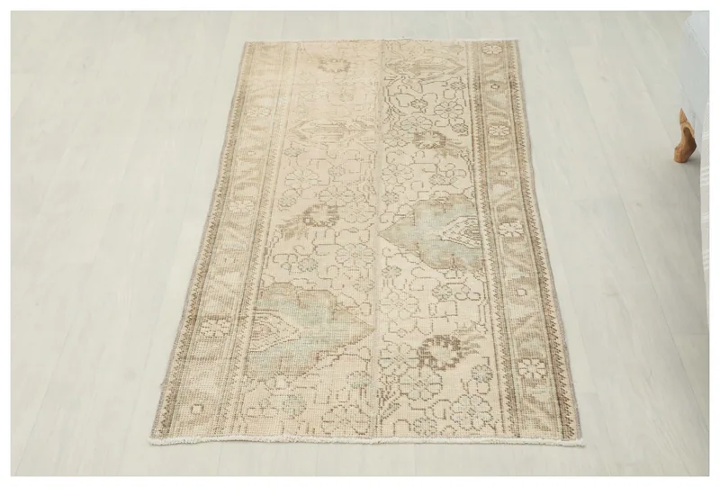 Full top view of the 2'6" x 4'11" vintage Anatolian rug on a white background.