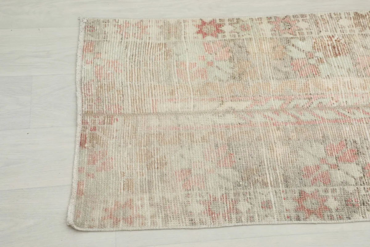 Detailed view of the vintage runner's texture and subtle color variations