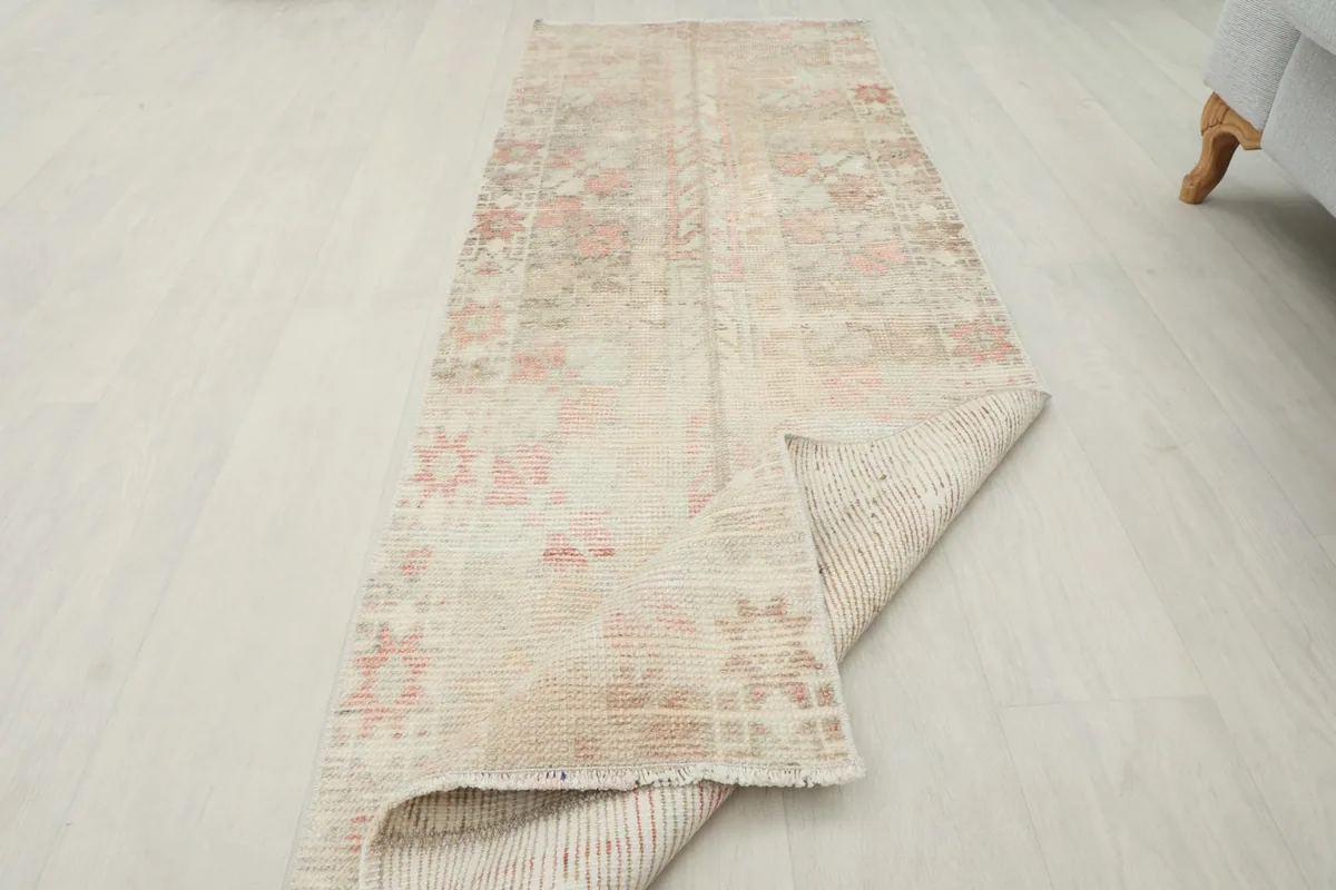 Rug partially folded to show the full length and the reverse side